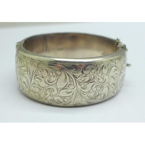 1078 - A wide hallmarked silver bangle, 44g, a/f, dented