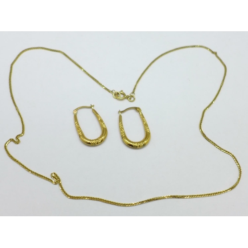 1094 - A fine 9ct gold chain and a pair of 9ct gold earrings, 2.8g