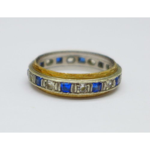 1097 - A 9ct gold, blue and white stone eternity ring, 3.1g, O