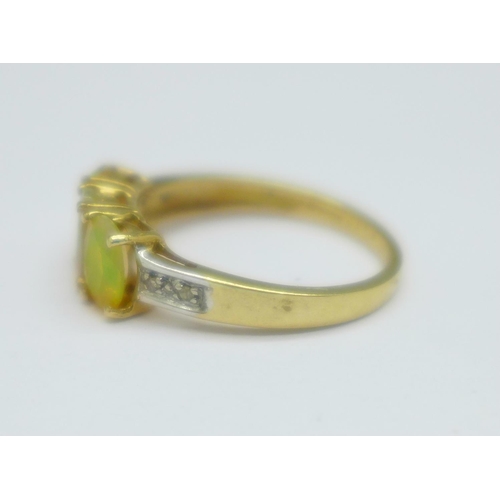 1099 - A 9ct gold and synthetic opal ring, 1.8g, J