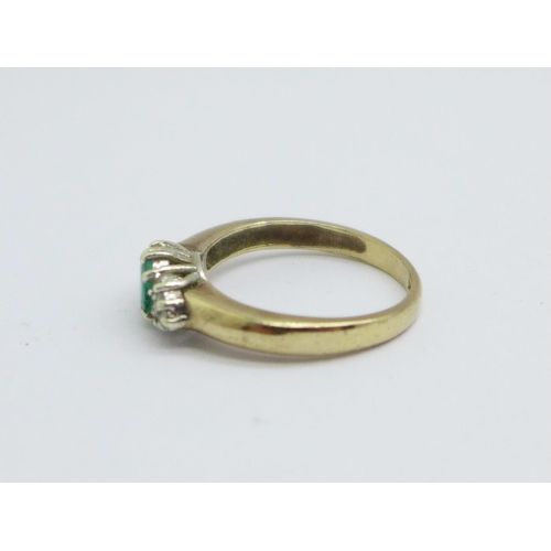 1119 - A 9ct gold, emerald and diamond ring, 2.6g, M