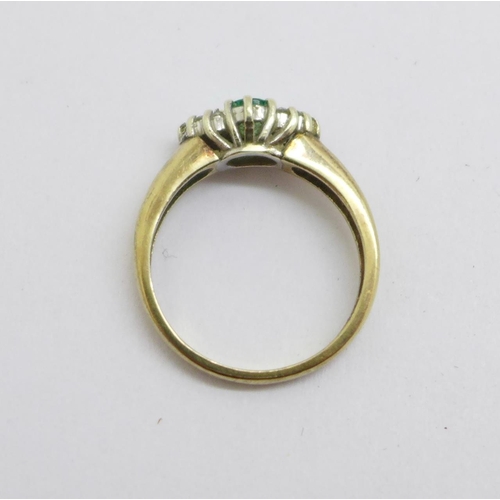 1119 - A 9ct gold, emerald and diamond ring, 2.6g, M