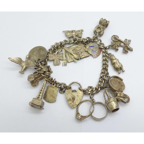 1126 - A silver charm bracelet, each link marked, 59g