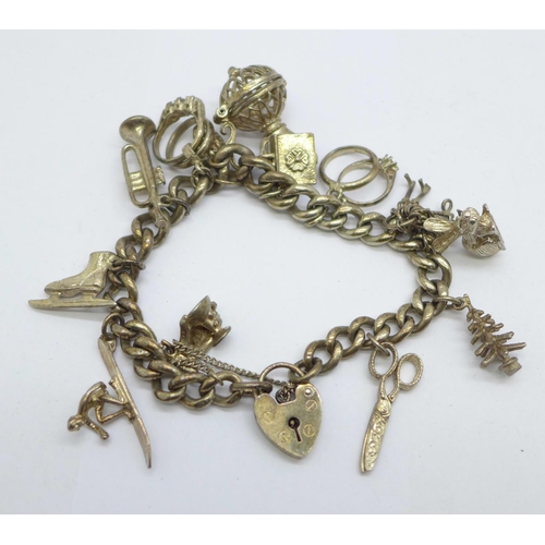 1127 - A silver charm bracelet, 56g