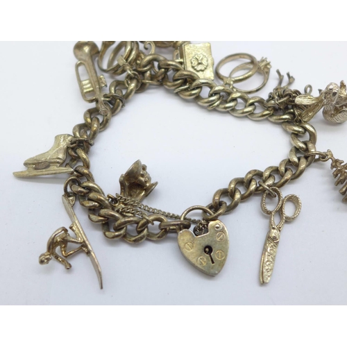 1127 - A silver charm bracelet, 56g