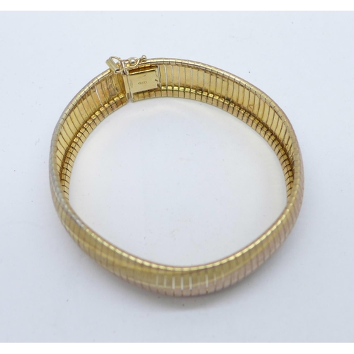 1134 - A silver gilt three colour bracelet, 25g