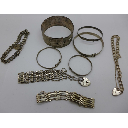 1153 - Four silver bracelets and five silver bangles, 107g