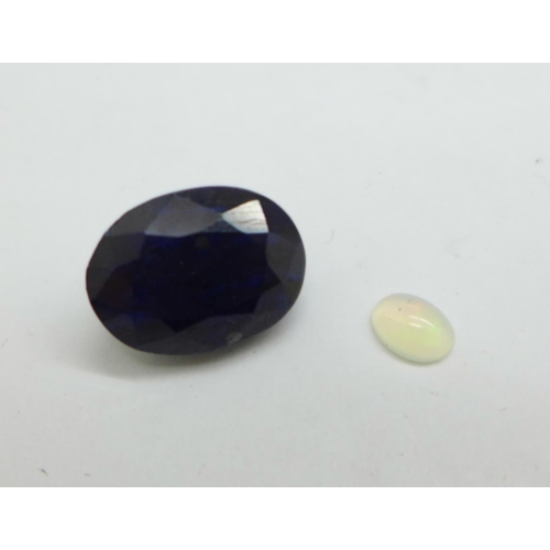 1154 - Two unmounted gemstones, blue sapphire, 15.50ct, and opal, 0.39ct, certified