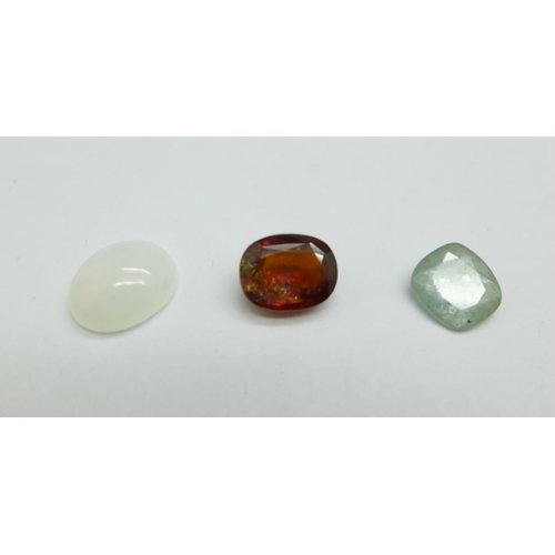 1155 - Three unmounted gemstones, green sapphire, 2.76ct, opal, 2.77ct, and garnet, 4.20ct, certified