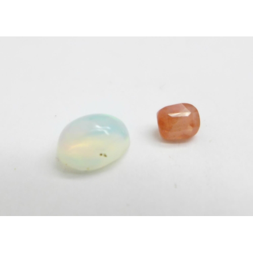 1157 - Two gemstones, 0.51ct orange sapphire and 0.80ct natural opal white, with GJSPC gemstone reports