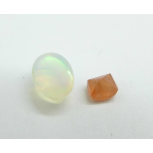 1157 - Two gemstones, 0.51ct orange sapphire and 0.80ct natural opal white, with GJSPC gemstone reports