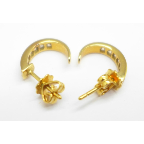 1161 - A pair of yellow metal earrings, the fasteners marked 750, 3.1g