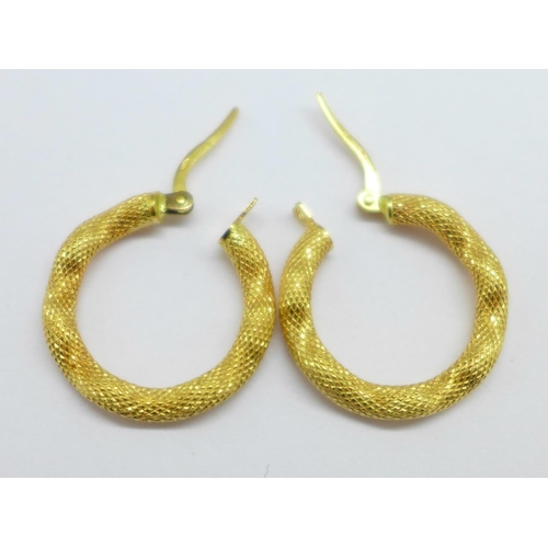 1163 - A pair of 18ct gold hoop earrings, 2.4g