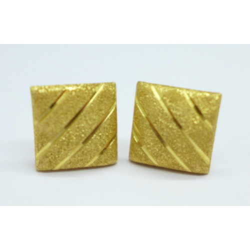 1166 - A pair of yellow metal earrings, the fasteners marked 750, 2.5g