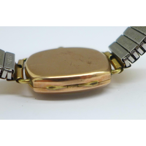 1175 - A 9ct gold cased wristwatch, Thomas Russell & Son, London 1945, on a Fixoflex bracelet strap, 28mm c... 