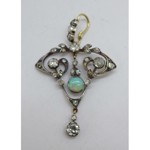 1187 - A Victorian opal and diamond pendant, 33mm wide, (gold back and silver settings)