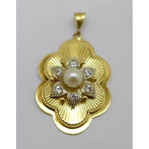 1193 - A 9ct gold, pearl and stone set pendant, 7.4g, 24mm wide