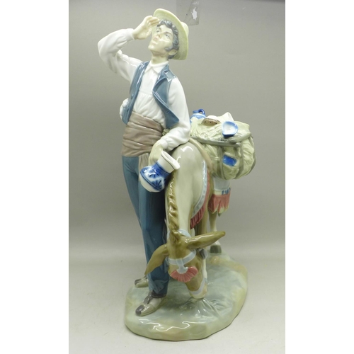 604 - A Lladro figure, Typical Peddler, 25.5cm