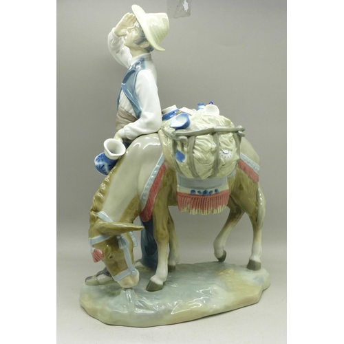 604 - A Lladro figure, Typical Peddler, 25.5cm