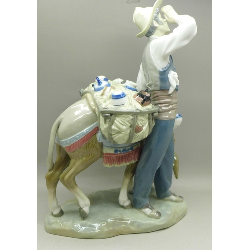 604 - A Lladro figure, Typical Peddler, 25.5cm