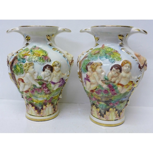 613 - A pair of Capodimonte vases, 28cm