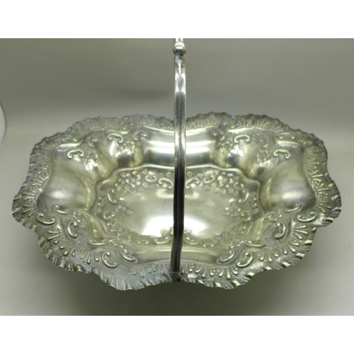 615 - A Victorian plated bowl with swing handle