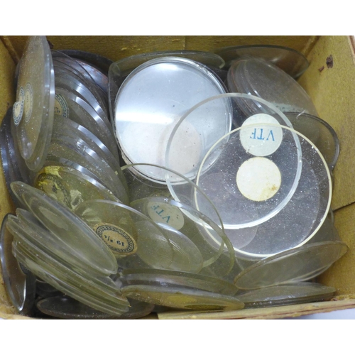 620 - A box of pocket and wristwatch glasses, most with size labels