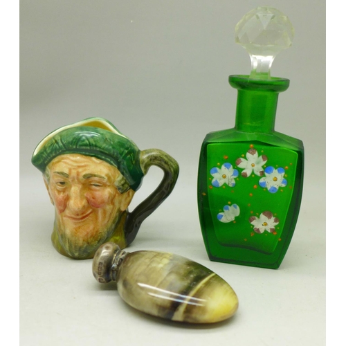 623 - A silver topped scent bottle with Geisha girl, a Royal Doulton miniature Auld Mac jug and a green gl... 