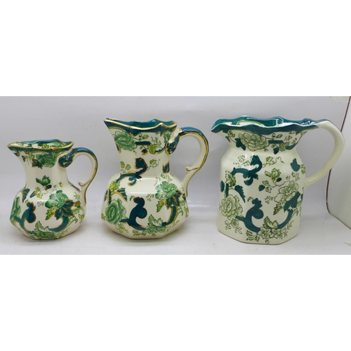 641 - A set of three Mason's Chartreuse graduated jugs