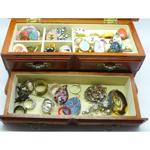 648 - A small cabinet of costume jewellery