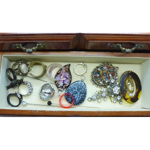 648 - A small cabinet of costume jewellery