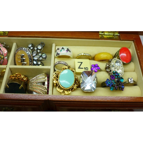 648 - A small cabinet of costume jewellery