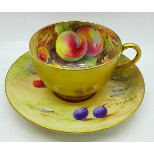 649 - A hand painted Royal Worcester cup and saucer, the saucer signed W H Austin and the cup signed R Aus... 