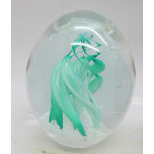 660 - Four glass paperweights including one handmade Molecular Cloud by Kenleys