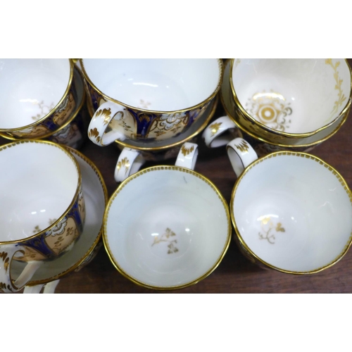 663 - A 19th Century part tea set of lobed form, comprising six cups and saucers and five coffee cups and ... 