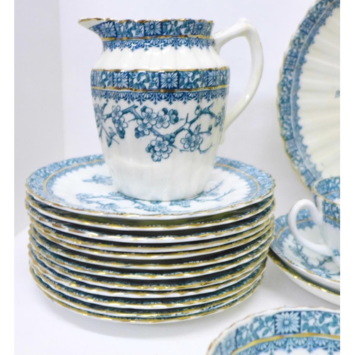 693 - An Edwardian twelve setting tea set, lacking one cup (three cups a/f)