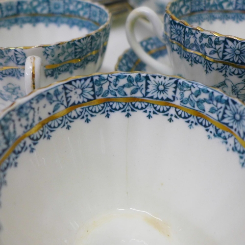 693 - An Edwardian twelve setting tea set, lacking one cup (three cups a/f)