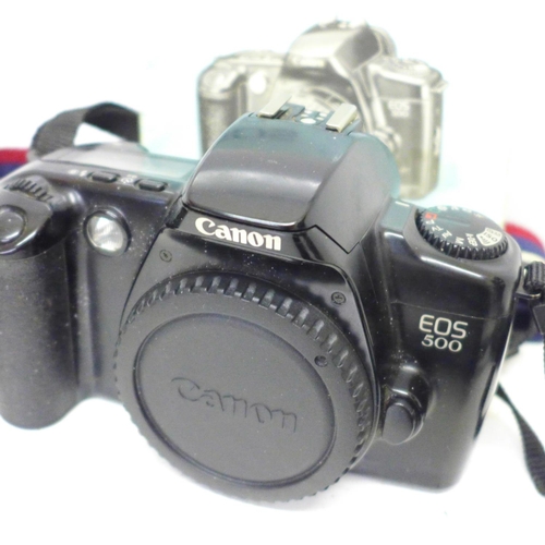 706 - A Canon EOS 500 camera body, Canon cap and strap and a Vivitar V635 body and strap