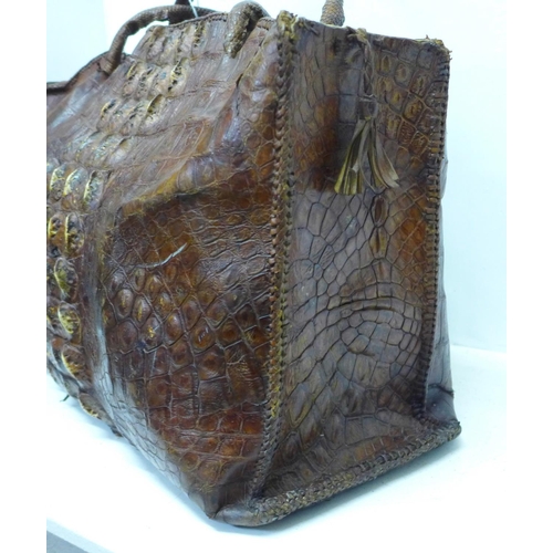 781 - A crocodile skin bag, width 48cm