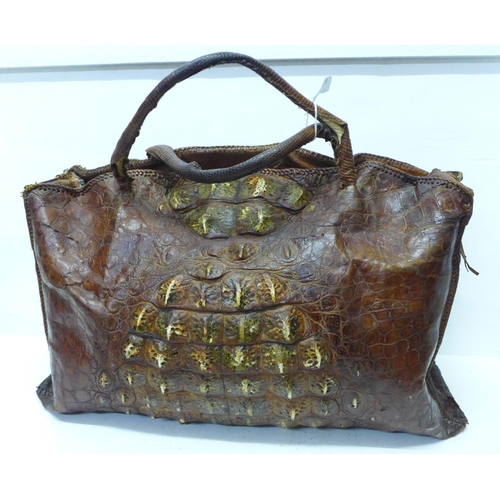 781 - A crocodile skin bag, width 48cm