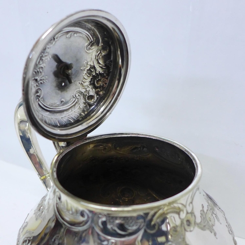 783 - A silver plated teapot by Elkington & Co., and a plated toast rack