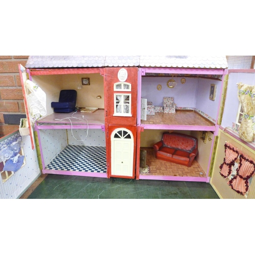 799 - A wooden dolls house with some furniture