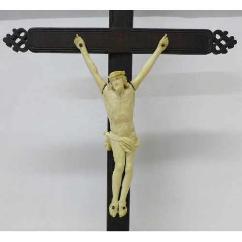 809 - A French 19th Century neo-Gothic carved wooden crucifix with carved bone figure of Christ, 47cm