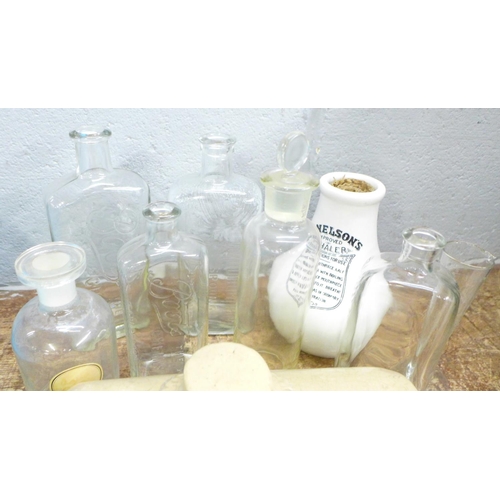 823 - Pharmaceutical ceramics and glassware including a Boots ceramic hot water bottle, a Nelsons inhaler,... 