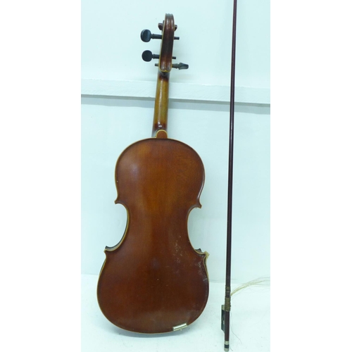 824 - A cased violin, length of back 36cm, case is a/f (front has come away from sides)