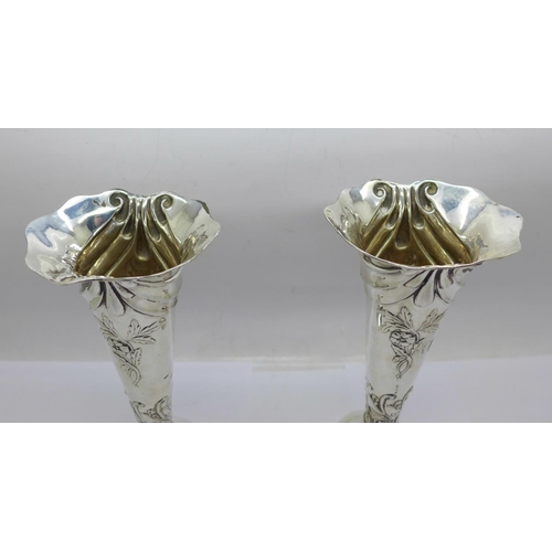 848 - A pair of Victorian silver vases, Birmingham 1899, 18cm, weighted