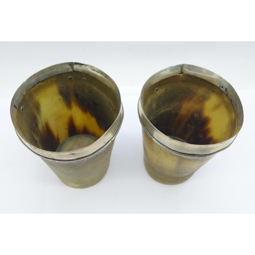 852 - A pair of 19th Century white metal mounted horn cups, 10.5cm