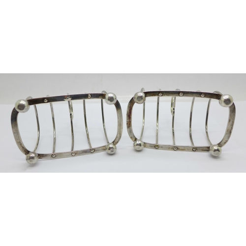 862 - A pair of Victorian silver toast racks, Henry Wilkinson & Co., London 1894, 130g