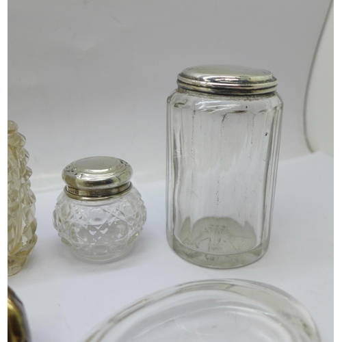 871 - Two silver topped glass jars, a silver mounted scent bottle, a double scent bottle, a/f, an oval bot... 