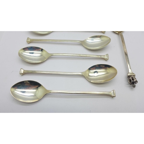 875 - Five silver coffee spoons, a silver commemorative spoon and a pair of silver sugar bows, 63g